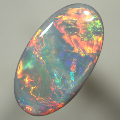 SOLID SEMI BLACK OPAL Top quality. Bright, strong fire in rolling flashes. SEE VIDEO